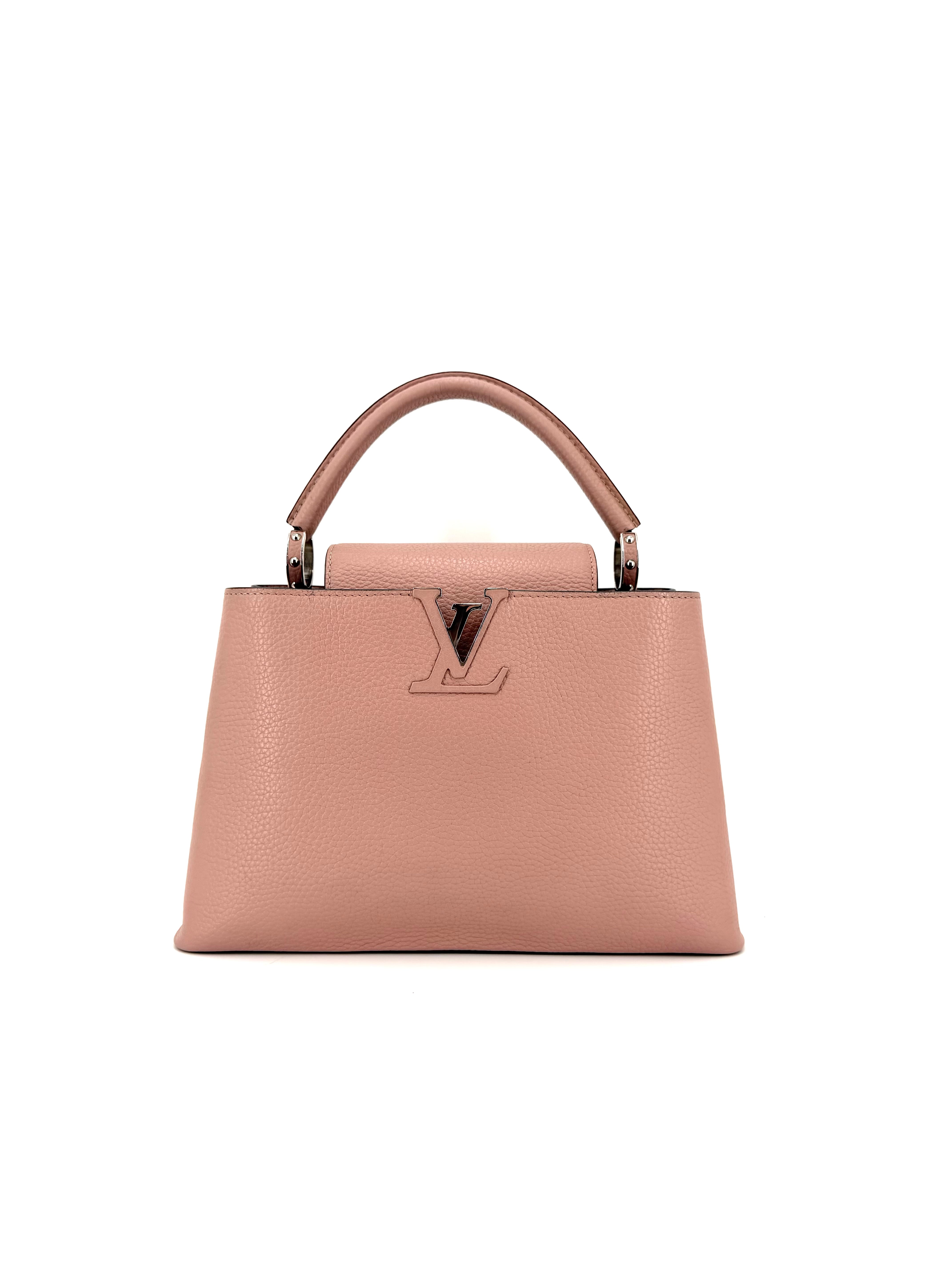 Authentic Louis Vuitton Capucines MM handbag in pink grained Taurillon leather with silver-tone hardware, structured trapezoid silhouette, top handle, and signature LV logo.