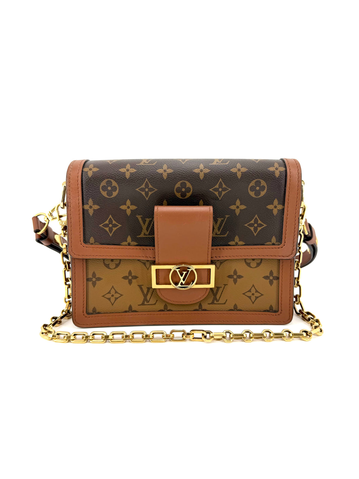 Authentic Louis Vuitton Dauphine MM in Monogram Reverse canvas with gold-tone LV magnetic closure, decorative chain, and adjustable shoulder strap.