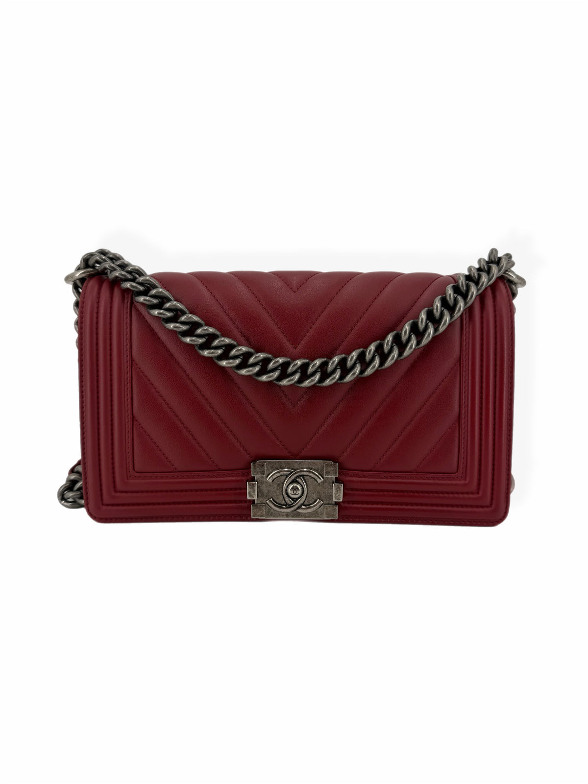 Chanel Medium Boy Bag in burgundy red chevron-quilted calfskin leather with aged ruthenium chain hardware and signature CC push-lock closure, front view.