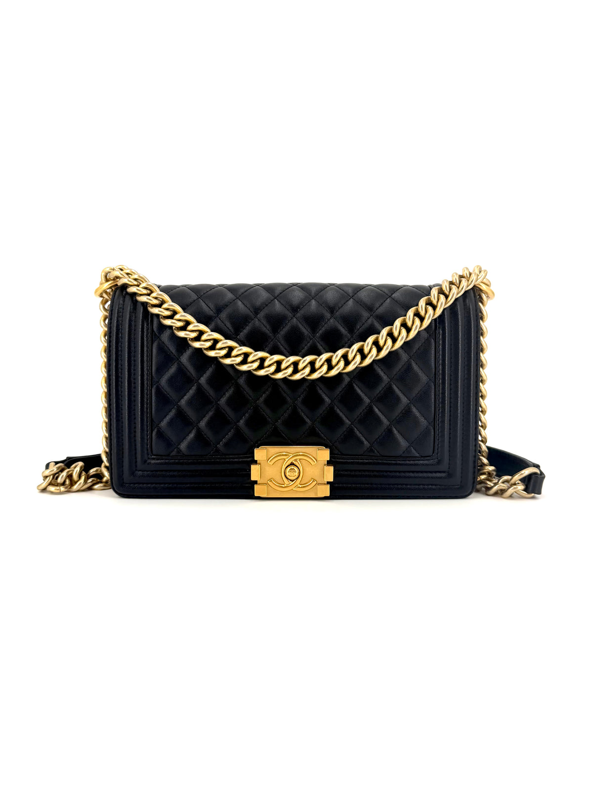 Authentic Chanel Boy Medium flap bag in black diamond-quilted leather with aged gold-tone hardware, chunky chain strap, and signature Boy push-lock closure.