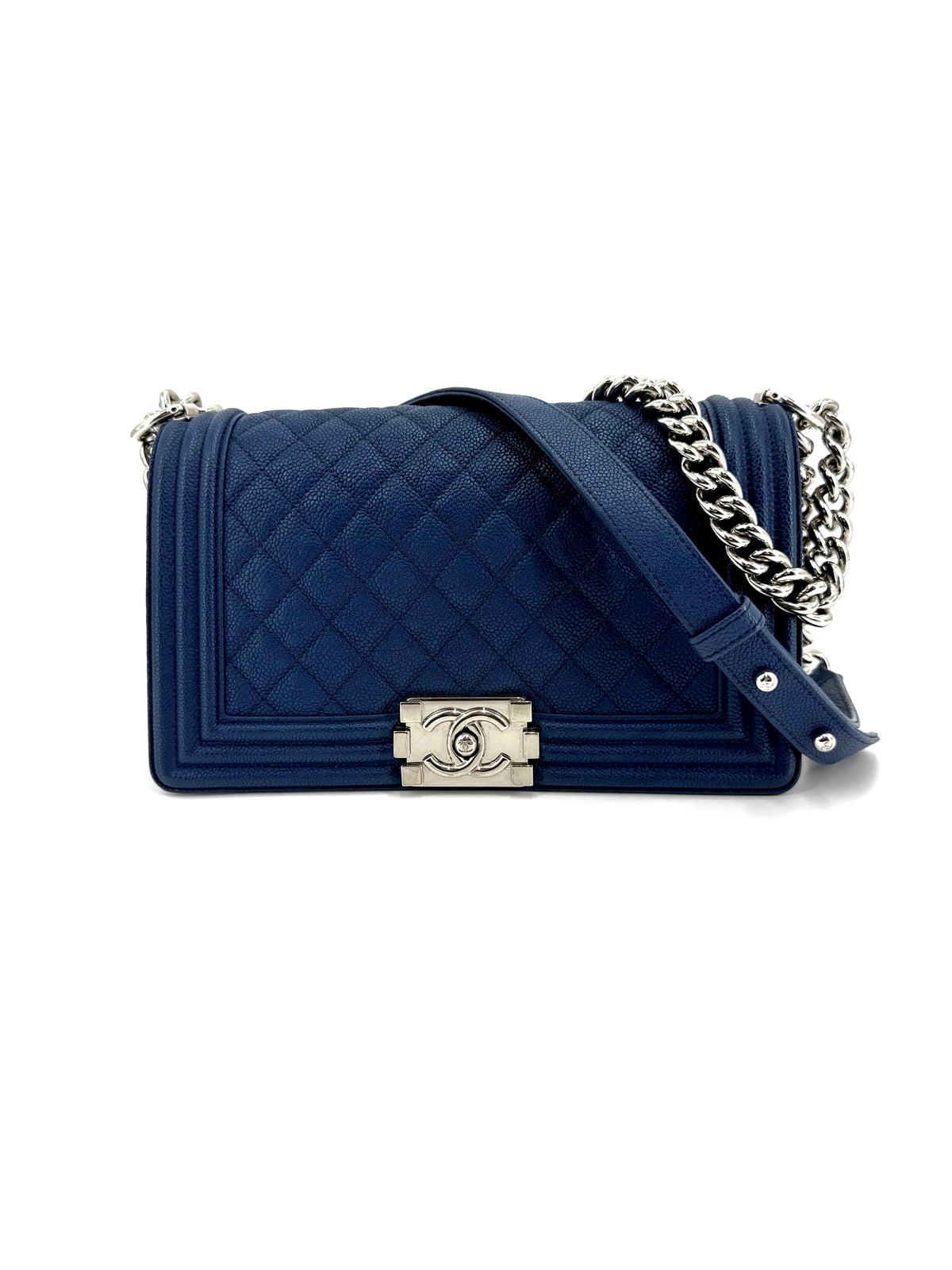 Authentic Chanel Boy Medium flap bag in navy blue diamond-quilted matte caviar leather with silver-tone hardware, signature Boy push-lock closure, and chain strap.